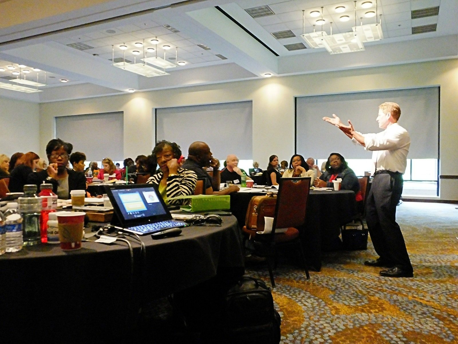 Rick Dahlgren presenting to a full ballroom of educators