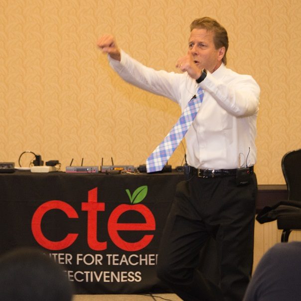 Rick Dahlgren teaching in front of the CTE banner